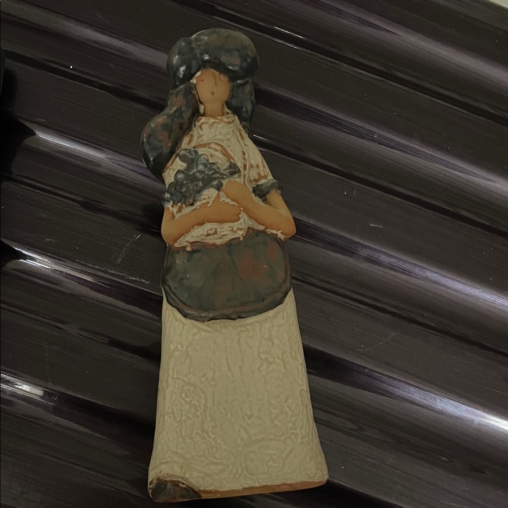 Artistic Figurine with Floral Accent